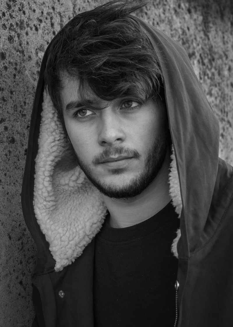hood - clothing, france, headshot, one person, looking at camera, scarf, leisure activity, young men, white, parking, adult, real people, hooded shirt