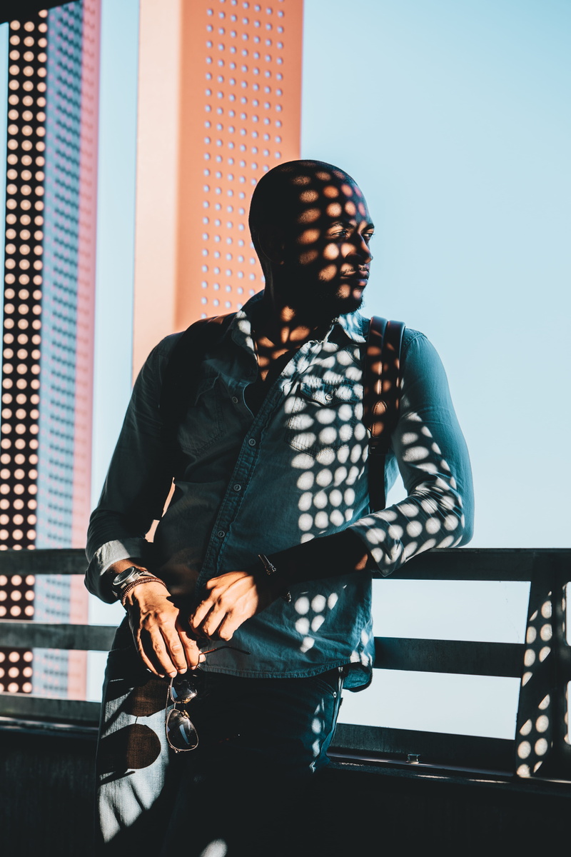lifestyles, city, male, blue, sitting, fashion, man, dark, city Life, leaning, sun, young Adult, one Person, style, males, cool, new York City, black Color