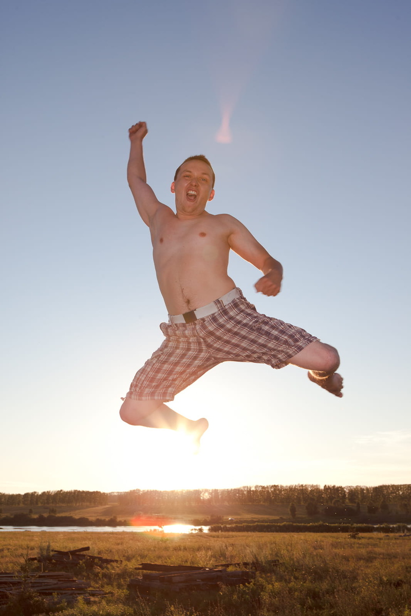 nature, land, human arm, adult, males, happy, human, happiness, day, people, real people, vitality, colour, field, young, action, jumping, one person, sunlight