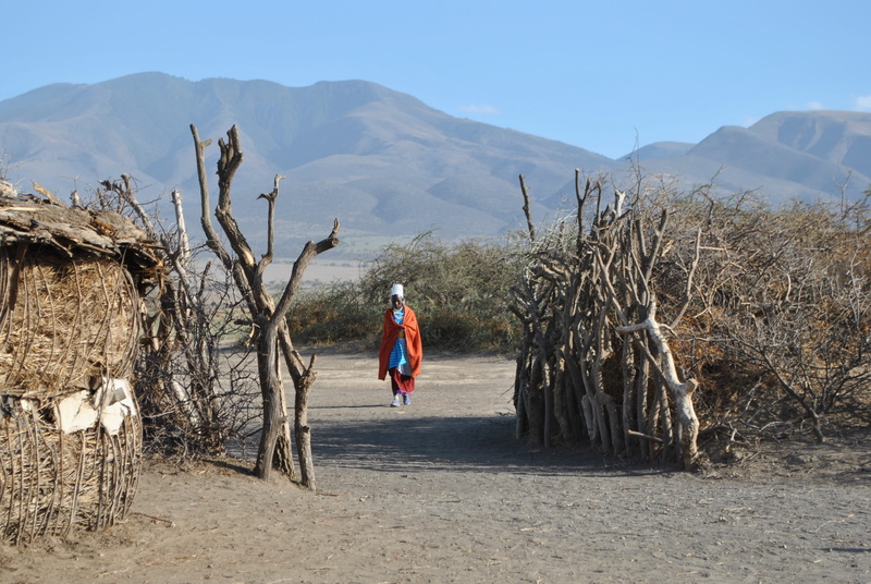 village, mountain, land, lifestyles, sky, full length, beauty in nature, rear view, scenics - nature, Africa, plant, outdoors, one person, casual clothing