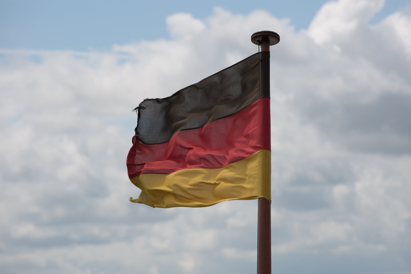 gold, cloud - sky, black, waving, german, patriotism, red, nature, mast, windy, yellow, low angle view, flag, symbol, flutter, emotion, blow, national icon