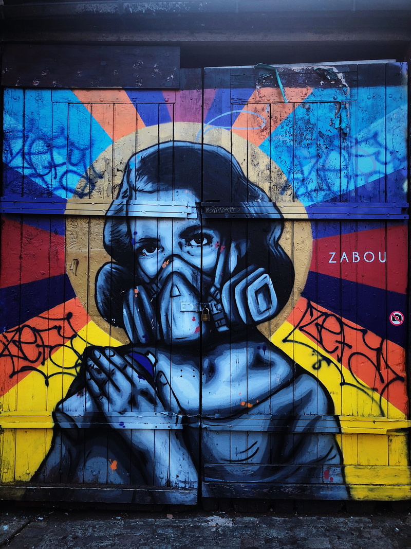 multi colored, outdoors, human representation, wall - building feature, mural, no people, day, sculpture, blue, woman, representation, communication, street art