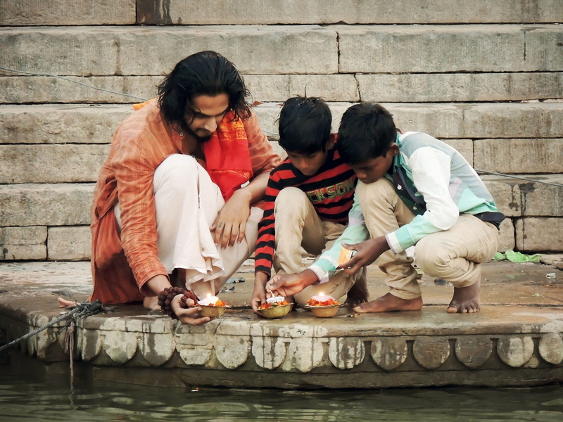 two, hindu, positive emotion, real people, spirituality, togetherness, body, water, bonding, god, candles, leisure activity, boys, females, day, lifestyles