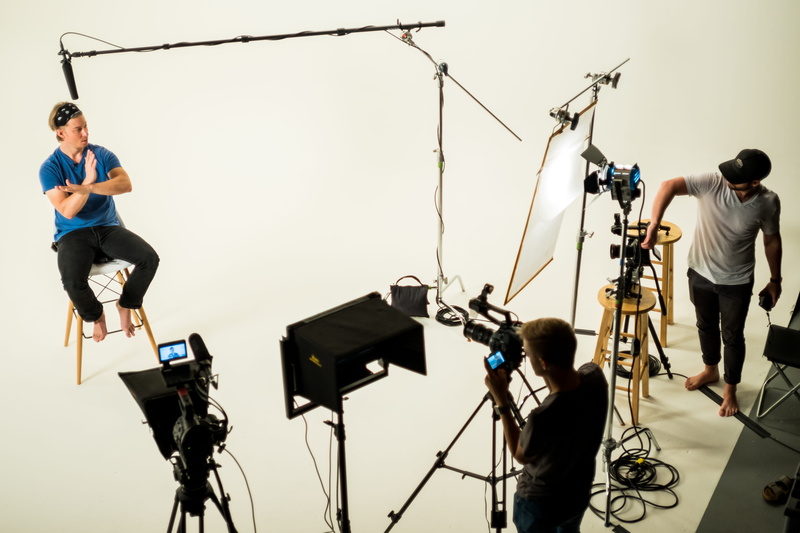 filming, camera - photographic equipment, originator studios, photography themes, occupation, television camera, real people, austin, bicycle, arts culture and entertainment