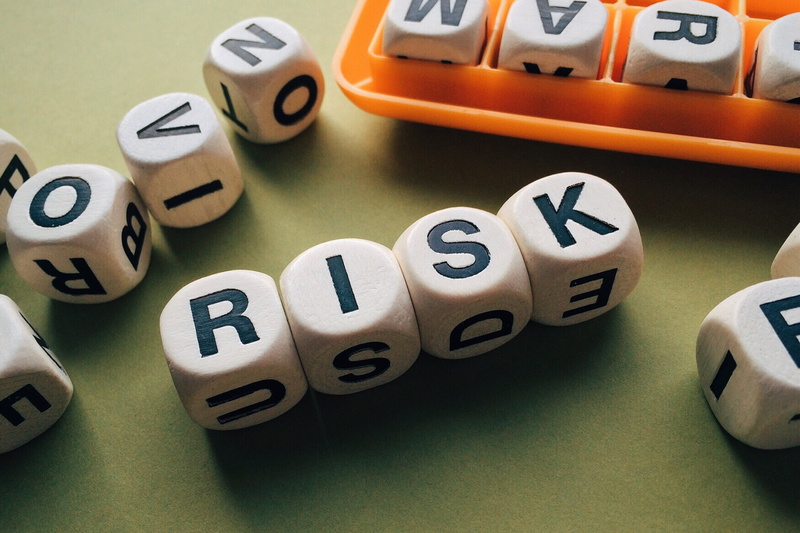 selective focus, close-up, financial figures, 2K, risk, game of chance, indoors, text, letters, number, game, word, colored background, dices, relaxation