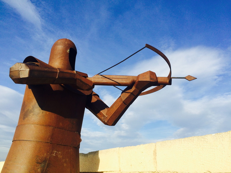 sunny, blue, Alicante, archer, architecture, no people, day, bronze statue, sign, low angle view, built structure, outdoors, metal, hanging, nature, Blue Sky