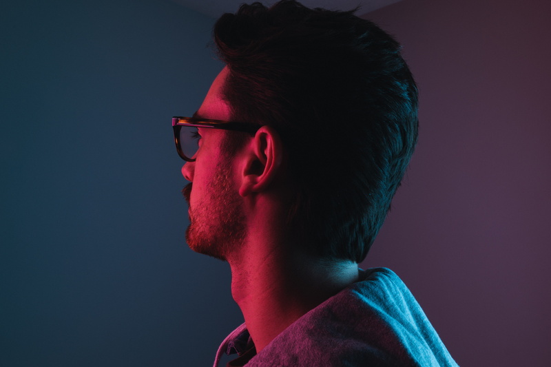 human face, contemplation, profile view, background, sideways, zaslavski, facing, young men, adult, human, studio shot, anton, eyeglasses, colored background