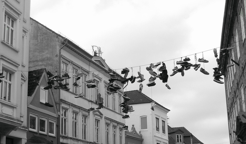 low angle view, shoes, day, residential district, sky, building, hanging, nature, clothesline, hang, outdoors, drying, laundry, depend, building exterior