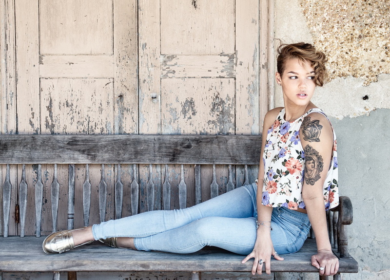 contemplation, adult, young adult, sitting, fashion, model, full length, relaxation, casual clothing, hair, looking at camera, wood - material, beautiful people