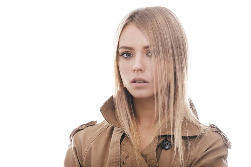 lip gloss, blonde, 2K, portrait, simple background, pink lipstick, model, coats, hair in face, looking at viewer, white background, teeth, open mouth