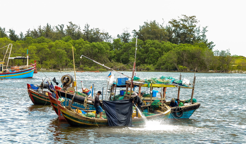 beauty in nature, waterfront, the boat, catching fish, nautical vessel, transportation, Sea, focus on foreground, mode of transportation, nature, sky, scenics - nature