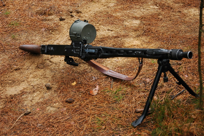 gun, man made object, high angle view, smg, machinery, Second, world, camera - photographic equipment, MG 42, outdoors, sunlight, technology, security
