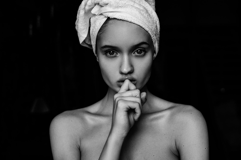 indoors, beautiful woman, semi-dress, hand, black background, young adult, studio shot, adult, one person, shirtless, looking at camera, front view, lifestyles