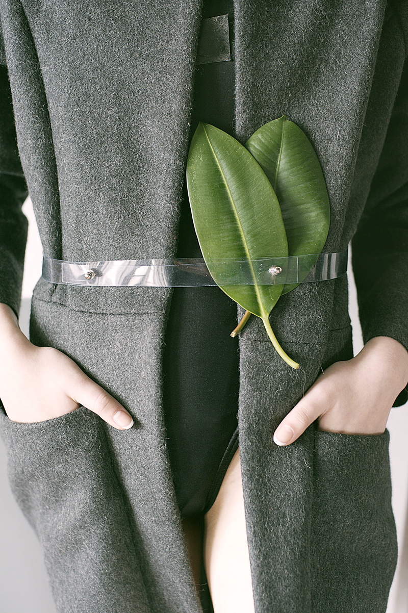gray, human hand, hand, leisure activity, belt, coat, finger, body part, leaf, holding, green color, fashionable, pocket, human limb, leaves, midsection