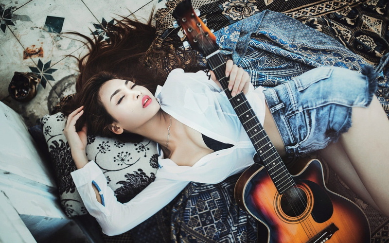 casual clothing, guitar, 720P, lying on back, bed, young adult, hairstyle, furniture, real people, young women, Asian, one person, adult, beautiful woman