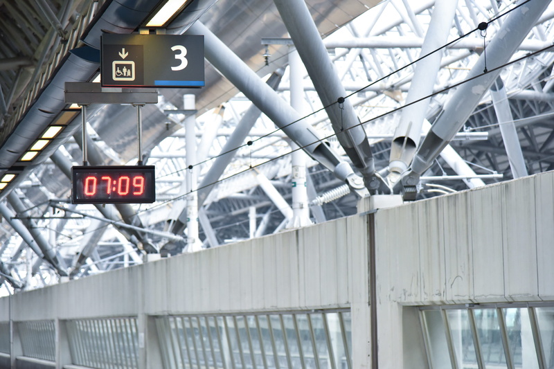 red, number, architecture, time, indoors, wall, transportation, travel, arrow symbol, guidance, clock, sign, daytime, leaving, day, text, information, industry