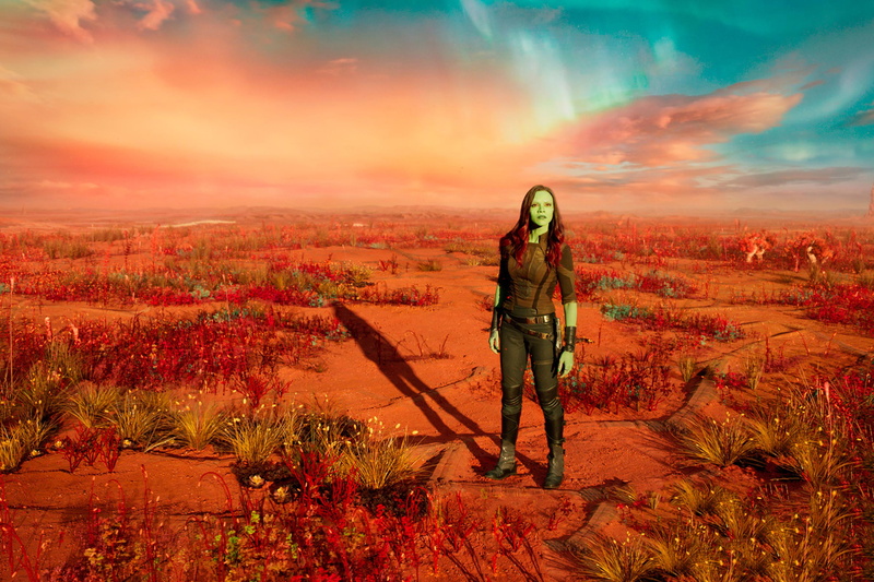 one person, movies, 2017 movies, environment, sky, casual clothing, standing, orange color, lifestyles, tranquility, gamora, beauty in nature, leisure activity