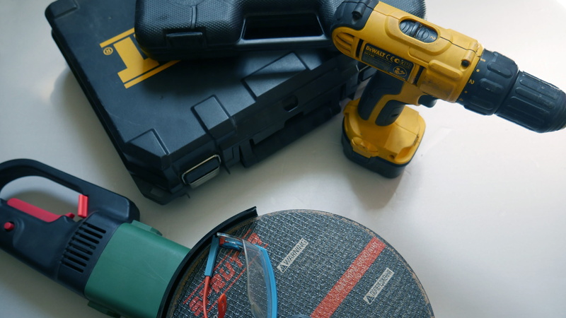 kit, home, drill, communication, ink, angle grinder, screwdriver, indoors, aggression, gun, goggles, hardware, transportation, human body part, repair