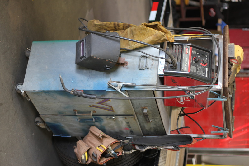hand tool, container, red, tool, electric, indoors, 5K, machine work, focus on foreground, garage, equipment, large group of objects, technology, no people
