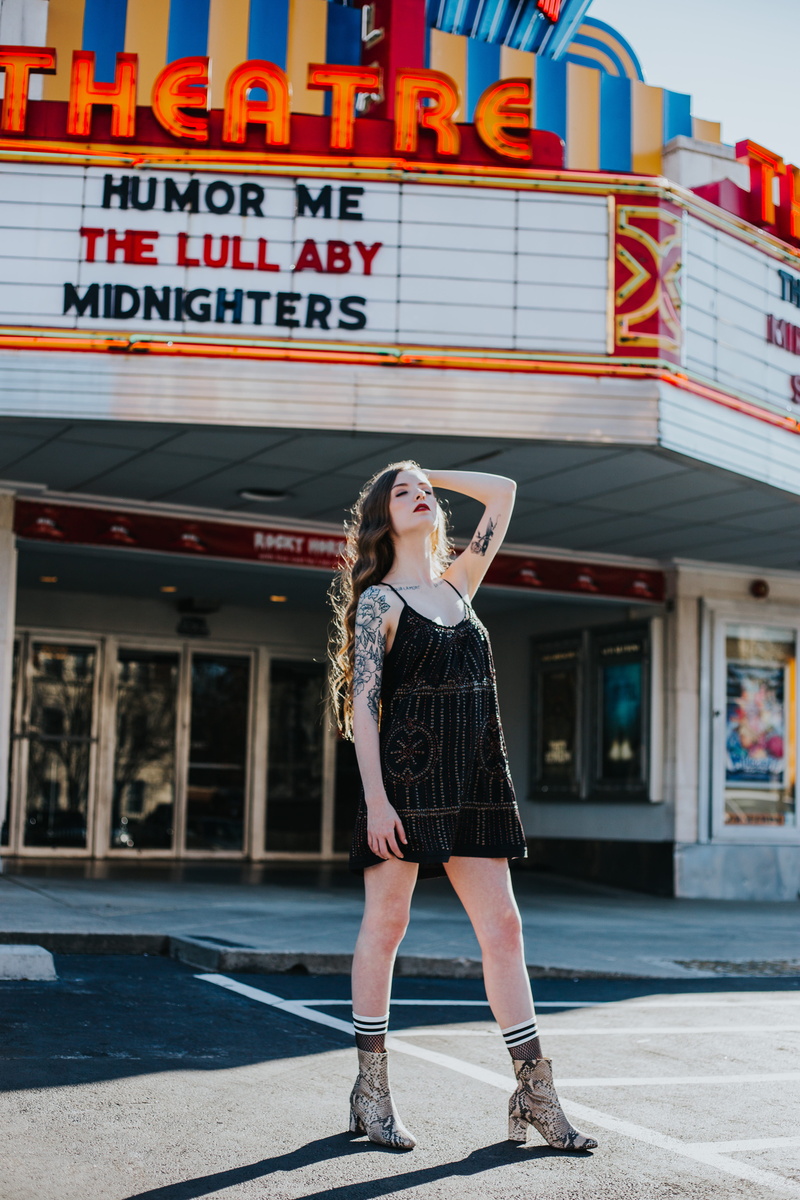 hairstyle, theatre, sky, casual clothing, lifestyles, cloudy, standing, lady, leisure activity, portrait, hair, female, built structure, building exterior