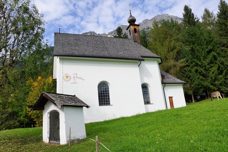 no people, rock, austria, building, spire, elmau, chapel, tyrol, cow, outdoors, hill, nature, built structure, day, faith, landscape, snow, clouds, ellmau