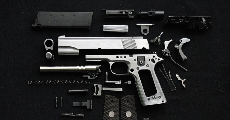 pistol, springs, screws, disassembled metal parts, 2K