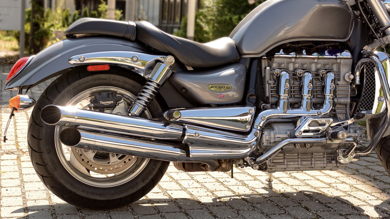 force, outdoors, metallic, vehicle, old, sunlight, dynamics, vintage car, street, no people, city, machine, triumph, gloss, 5K, side view, power, wheel