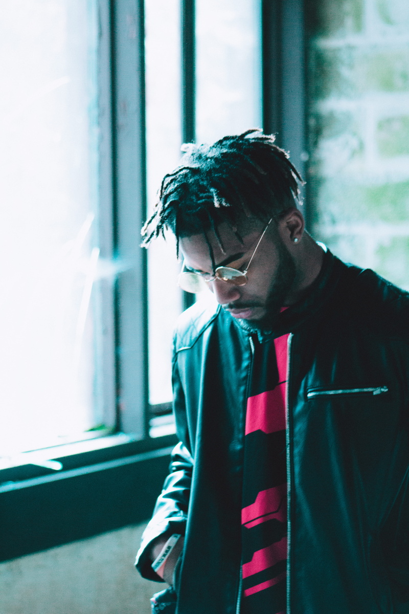 window, waist up, fashion, braids, united states, ghetto, lighting, modern, african, uzi, eyeglasses, young men, rap, lifestyles, dark, architecture, casual clothing