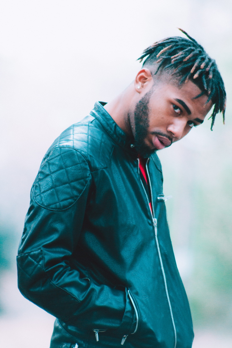 urban, united states, hood - clothing, leisure activity, beard, focus on foreground, music, looking at camera, dark, modern, african, portrait, clothing
