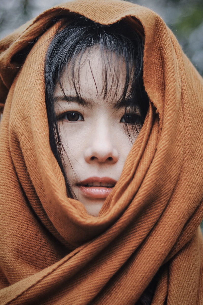 headshot, obscured face, child, 2K, wrapped in a blanket, lifestyles, body part, warm clothing, clothing, indoors, real people, portrait, headdress, human face