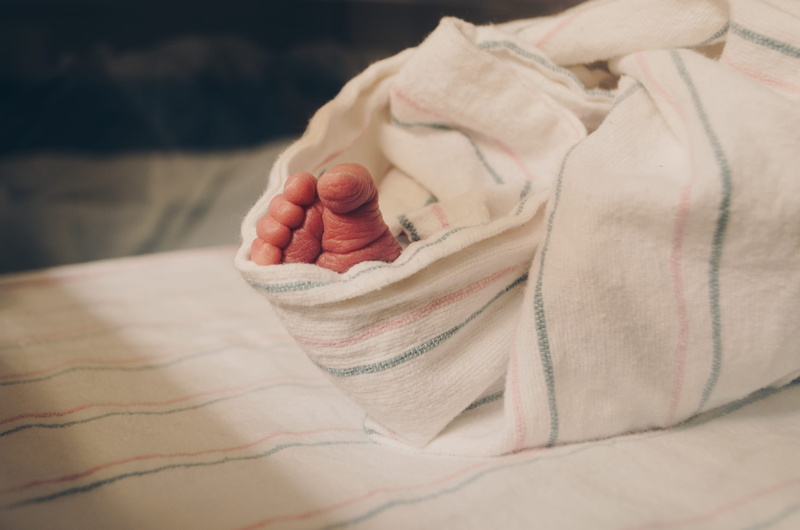 wrap, human foot, toes, young, textile, infant, nursery, first, newborn, parent, hand, wrinkles, indoors, one person, mother, softness, feet, body part