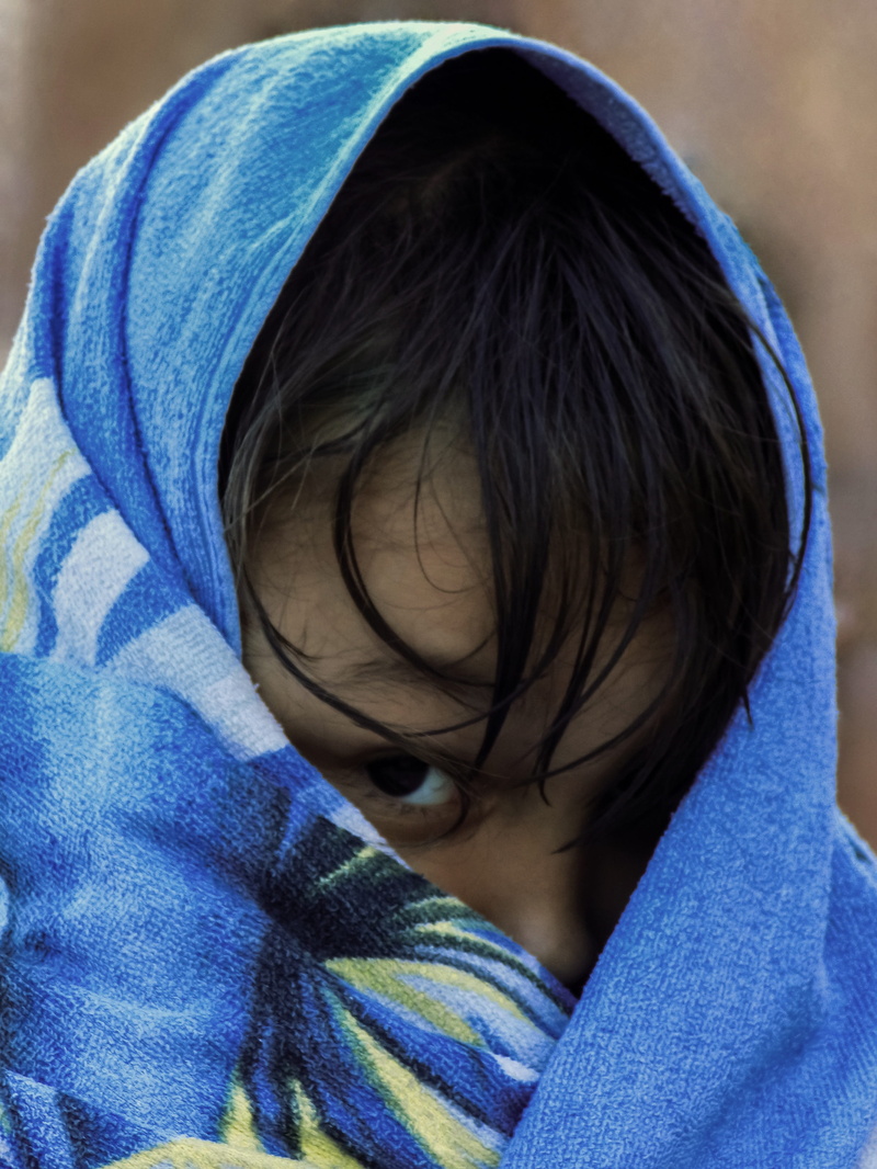 real people, blanket, childhood, innocence, wrapped in a blanket, clothing, save the children, child, men, males, boys, one person, hair, hood - clothing