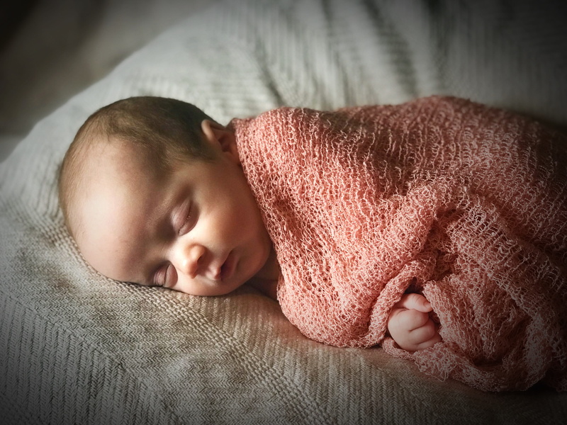room, napping, innocence, sleep, one person, furniture, sleeping, relaxation, real people, sleeps, wrapped in a blanket, lying down, white, indoors, portrait