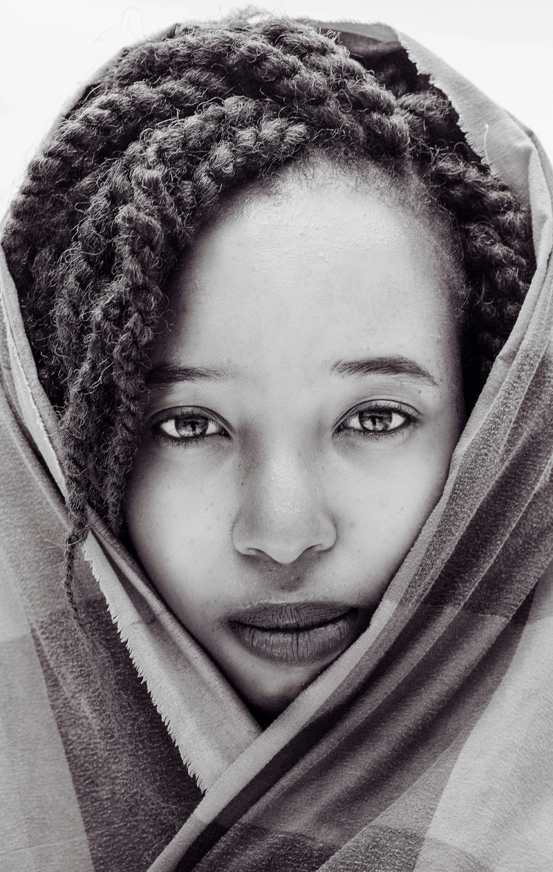 young adult, lifestyles, wrapped in a blanket, person, photo, front view, young women, human face, close-up, looking at camera, beautiful woman, grayscale