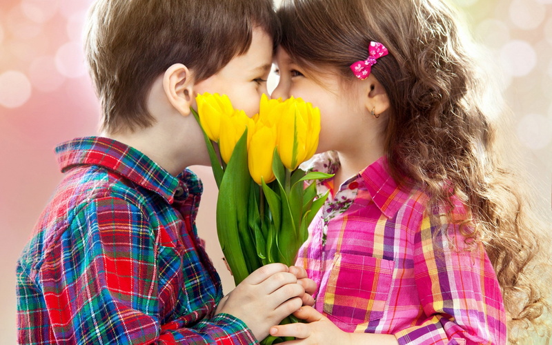 couple - relationship, yellow, children, togetherness, shirt, happiness, kiss, s, headshot, offspring, love, childhood, females, flowers, women, adult