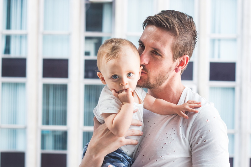 family, cute, family with one child, real people, facial hair, son, depth of field, child, holding, bonding, adorable, infant, focus, adult, dad, positive emotion