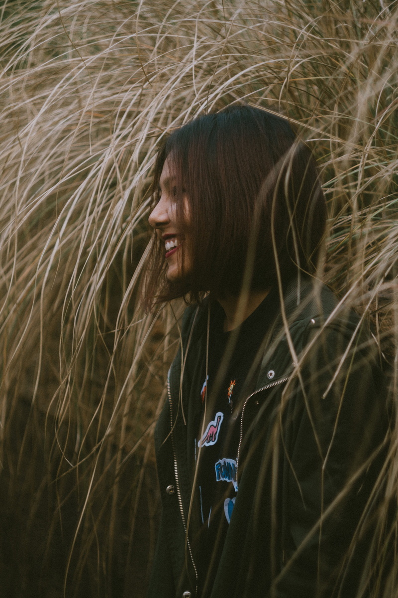 sideways, waist up, jacket, 2K, woman, portrait, leisure activity, looking, nature, teenager, hair, day, field, one person, lifestyles, land, outdoors