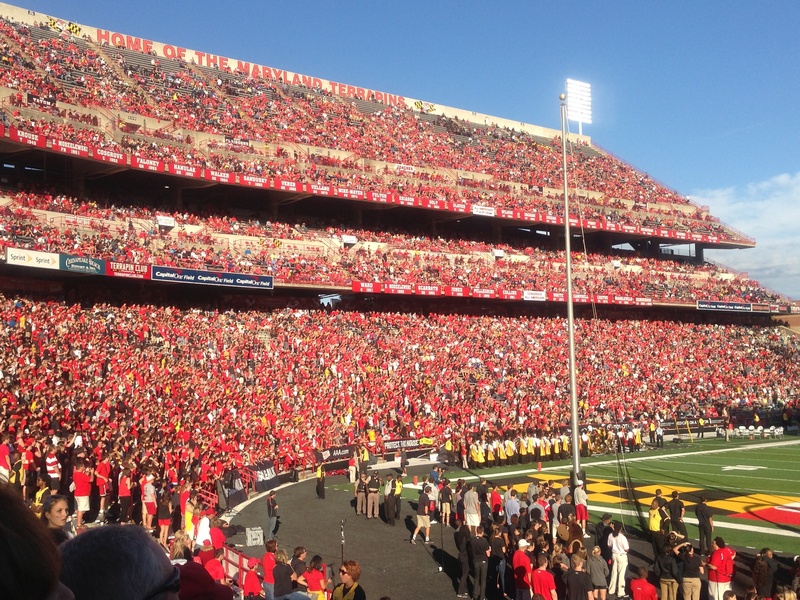 team, gridiron, american, team sport, sitting, collegiate, athletics, support, people, outdoors, cheering, daytime, college, red, nature, men, crowd, architecture