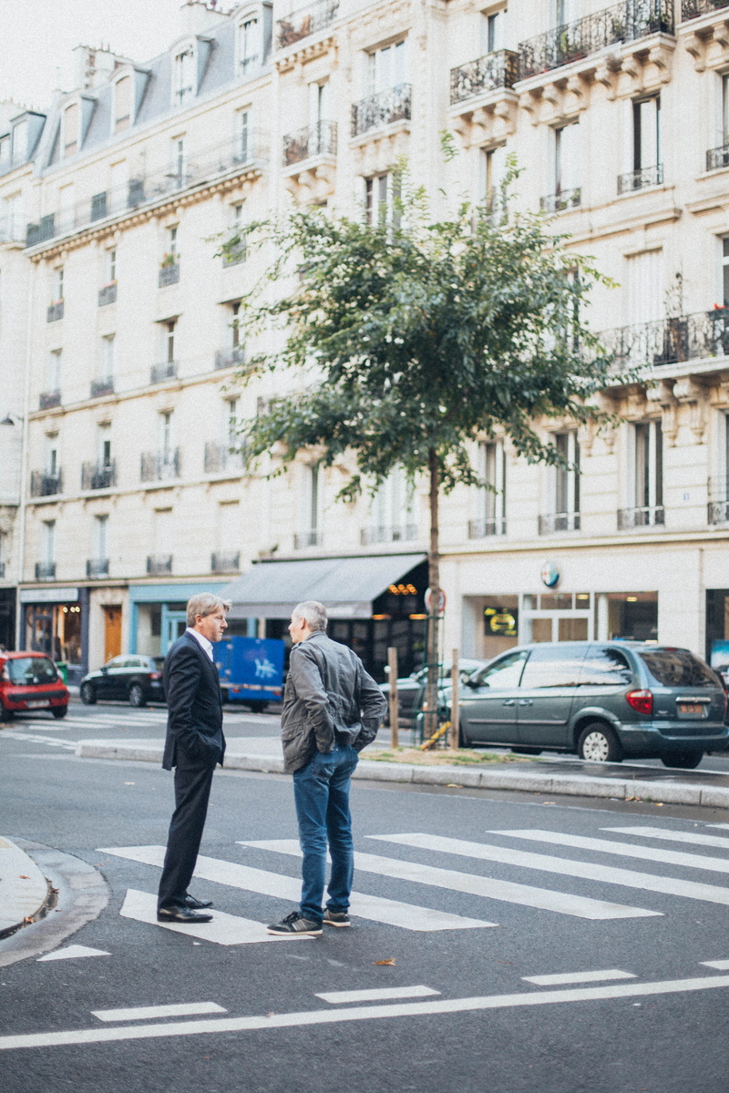asphalt, outdoors, commerce, two people, heterosexual couple, road, transportation system, city life, pedestrian crossing, street, cars, day, car, transportation