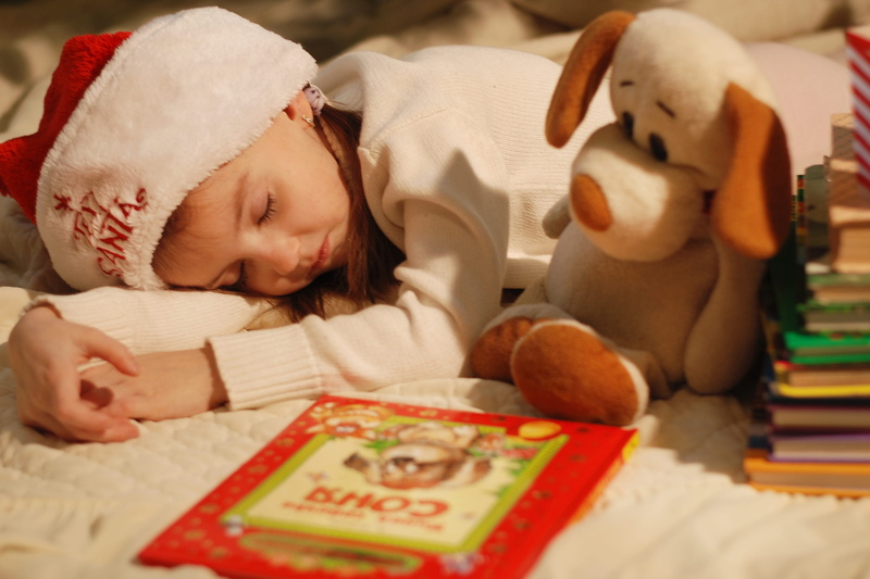 domestic room, holiday, new years eve, sleeping, indoors, bed, relaxation, young, Santa hat, childhood, red, 2K, innocence, book, baby, toy, teddy bear