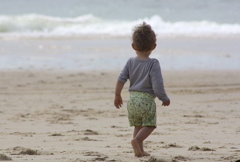 innocence, facing the sea, ocean, land, sea, near, water, beach, leisure activity, real people, relaxation, holiday, toddler, shore, sand, day, one person