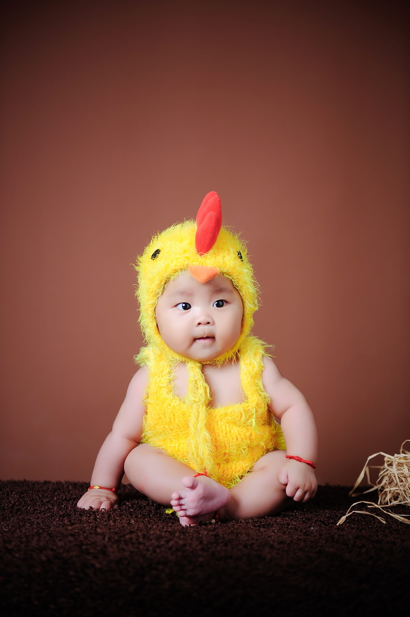 babyhood, young, toy, front view, child, one person, the little girl, portrait, childhood, cute, studio shot, toddler, baby, innocence, yellow, indoors