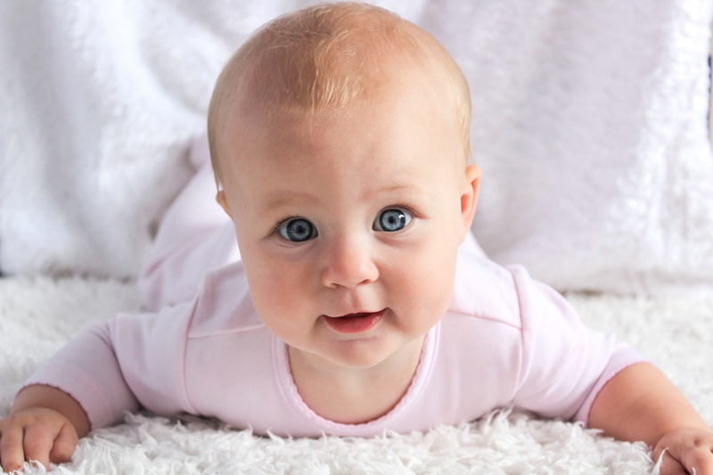 childhood, portrait, babyhood, happiness, face, beautiful, little, smiling, one person, lying down, 5K, precious, looking at camera, infant, young, baby