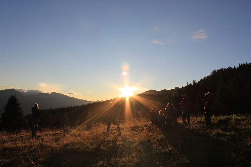 sun, landscape, leisure activity, sunset, scenics - nature, lens flare, worship, non-urban scene, sunrise, real people, men, group of people, people, beauty in nature