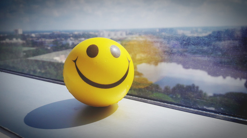 smiling, table, rubber duck, focus on foreground, fun, ball, happy, smile, indoors, yellow, anthropomorphic smiley face, close-up, smiley, water, nature