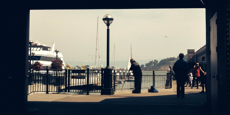 pier, men, clear sky, built structure, full length, real people, city, group of people, railing, boats, old school, outdoors, standing, america, moments