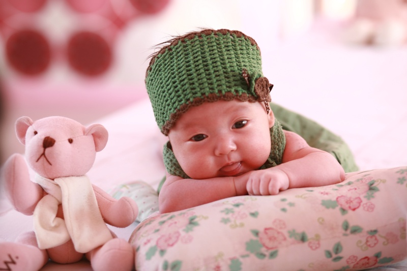 animal representation, new born, lying down, innocence, furniture, one person, baby, bed, childhood, stuffed toy, indoors, toy, people, baby clothing, representation