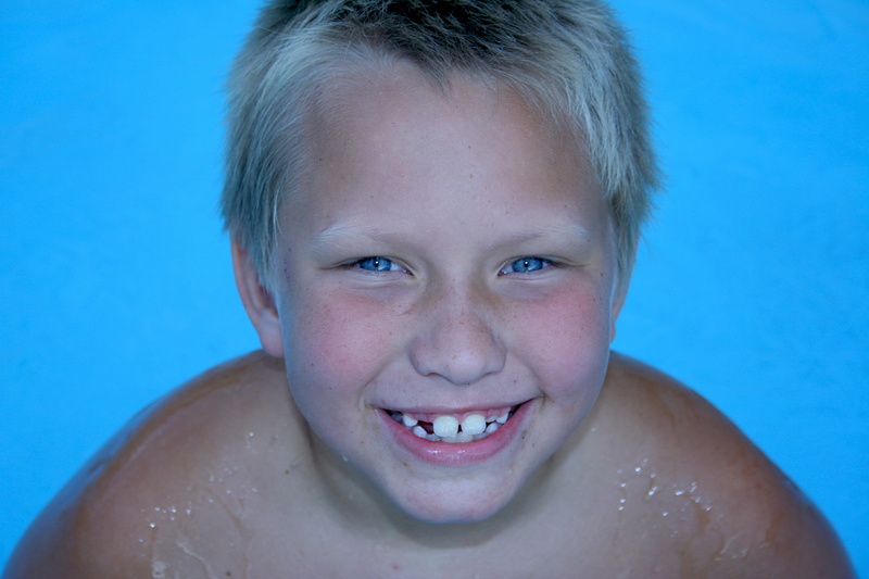 blue, front view, blue background, emotion, body part, happiness, human face, swimming, swimming pool, Laughing, 2K, gap toothed, human body part, portrait
