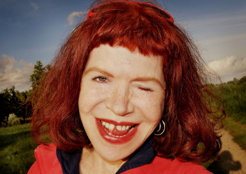 nature, one person, windblown hair, attractive, human face, redhead, headshot, front view, young women, woman, looking at camera, close up, emotion, face