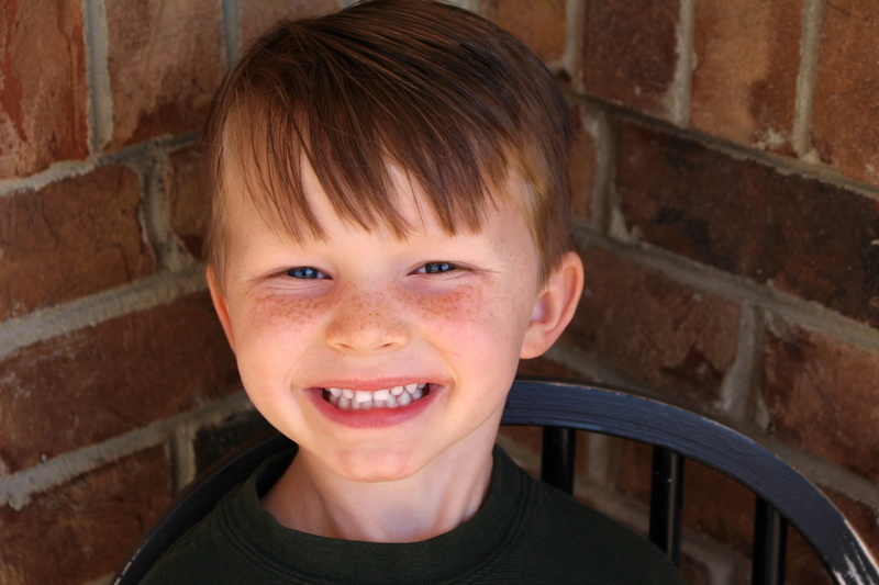 cheerful, looking at camera, kid, happiness, young, boys, offspring, summer, body part, emotion, brick, portrait, innocence, happy, smiling, close-up, gap toothed